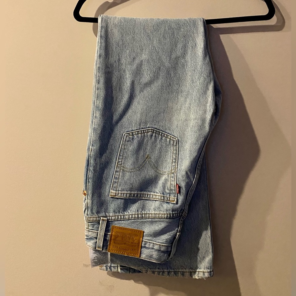 Levi’s Ribcage Flare Jeans. Light wash rigid denim. 28W32L but fits like 26-27.